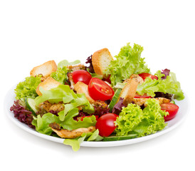 Caesar salad with grilled chicken isolated on white