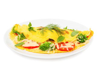 omelet with cheese, broccoli and tomatoes on white