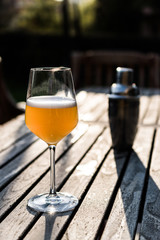 Bellini Cocktail made with peach in wine glass at garden