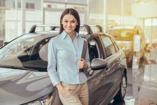Young Woman in a Car Rental Service Assistant Concept