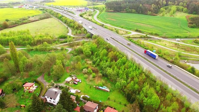 Aerial view of bridge over Radbuza River and green pastures. Highway D5 with traffic near Pilsen, Czech republic, Central Europe. Transportation and sustainable development concept. 