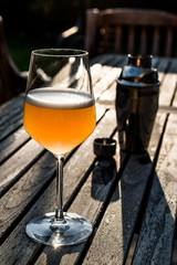 Bellini Cocktail made with peach in wine glass at garden