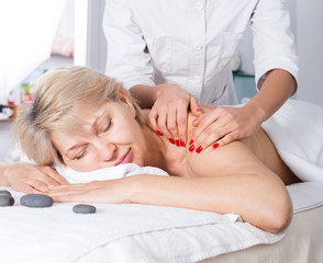 Fototapeta na wymiar Mature woman having massage