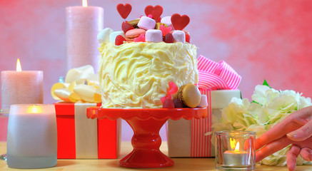 Preparing and decorating pink party table.