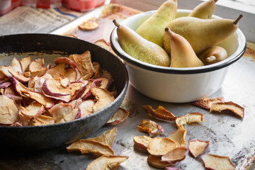 Dried apples and pears in bowls. Rustic vintage style