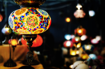 Traditional turkish glass lantern haging from a market stall