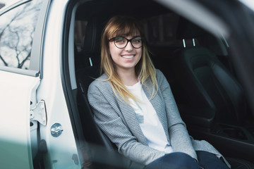 Fototapeta premium successful young woman in the car