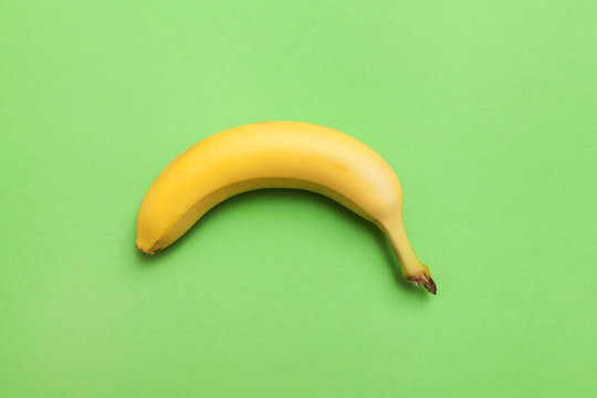 ripe banana on a green background