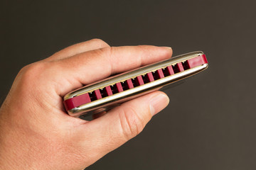 Metal labret in hand.