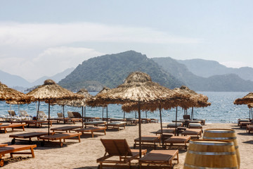 sand beach with umbrellas
