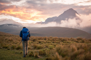 Man hiking by mountains, Ecuador, South America 
