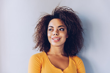 Exited smiley face  African American girl portrait at home.Happiness concept