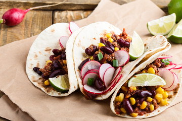 Chili con carne tacos on craft paper