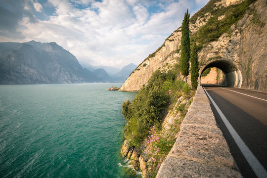 Fototapeta Road passing through tunnel by the Lake Garda
