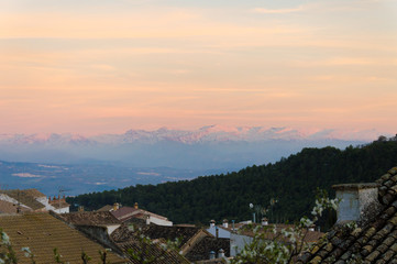 Idyllic panorama view of Sierra Nevada during sunset in March, captured in Moclín, Andalusia, Spain