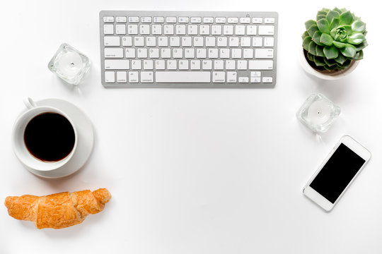 woman working place with coffee and keyboard on white background top view mockup