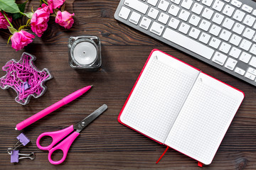 female desktop with keyboard and notebook wooden background top view mock up