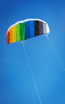 Kite rainbow colors fly high in the sky