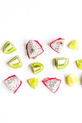 pattern with sliced kiwi and pitaya on white background top view mockup