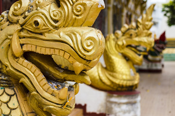 Fototapeta na wymiar Dragon statues in Wat Luang - buddhist temple in Pakse, Champasak province, Laos