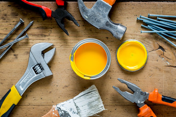 instruments set for decorating and building renovation on wooden background top view