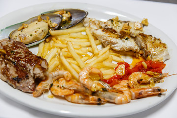 plate of seafood with chips