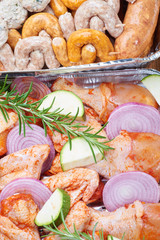 Marinated meat and vegetables prepared for grilling
