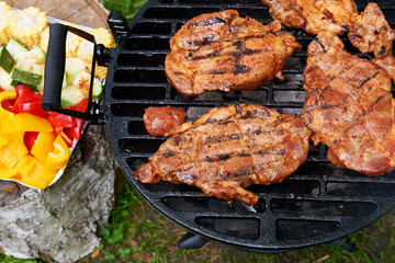 Meat during grilling. Chuck steak with herbs and spices