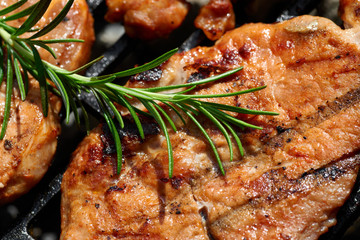 Meat during grilling. Chuck steak with herbs and spices