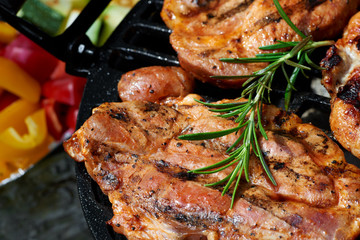 Meat during grilling. Chuck steak with herbs and spices
