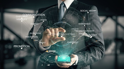 Businessman with Internet Marketing hologram concept - obrazy, fototapety, plakaty