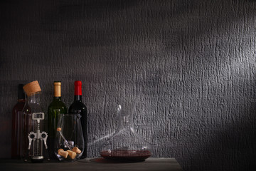 Glass carafe of wine on table against gray background