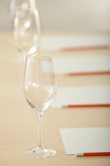 Glasses and cards prepared for wine estimating on table