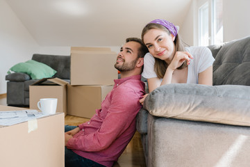 Satisfied new homeowners in their living-room