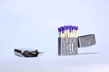 Many match sticks inside a lighter case isolated