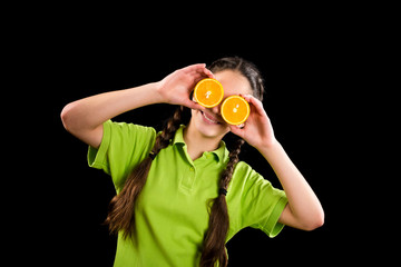 funny girl with sliced orange on eyes