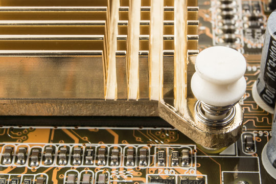 Radiator on chip of northbridge of computer motherboard close macro.