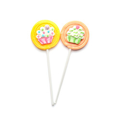 Tasty colorful lollipops on white background