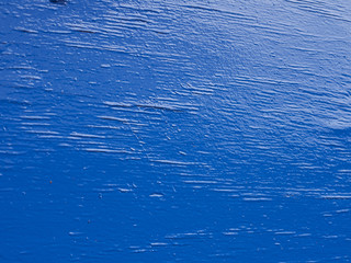 Blue paint on rough surface