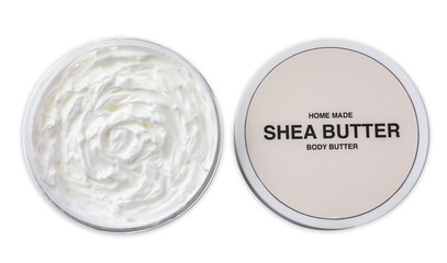 Jar of shea butter on white background