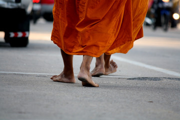 Buddhist monks walking for receive food from the people 