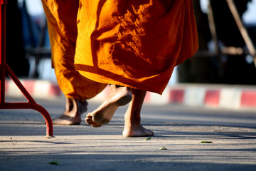 Buddhist monks walking for receive food from the people 