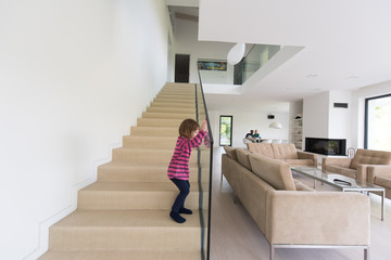 family with little girl enjoys in the modern living room