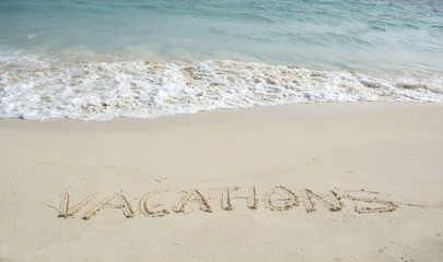 Word Vacation on beach.
