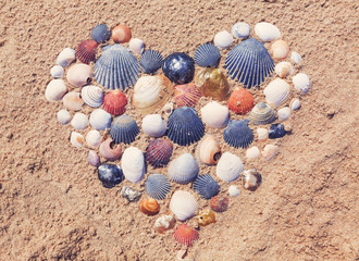 Heart made of seashells on the beach