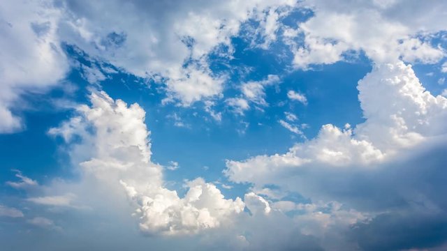 Time lapse of the serene blue sky is adorned with puffy, fluffy white clouds, creating a mesmerizing cumulus cloud cloudscape.