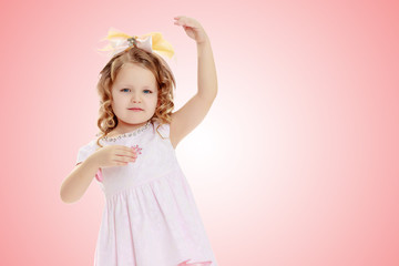 Girl shows the doll.