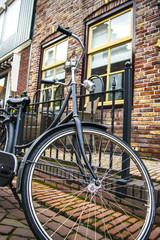 Fototapeta na wymiar Bicycle next to house in the Netherlands