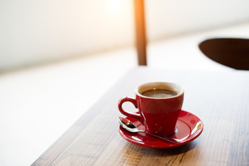 Hot black coffee on table. Vintage filter