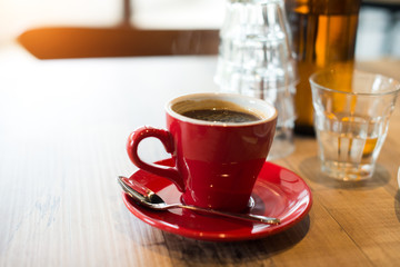 Hot black coffee on table. Vintage filter